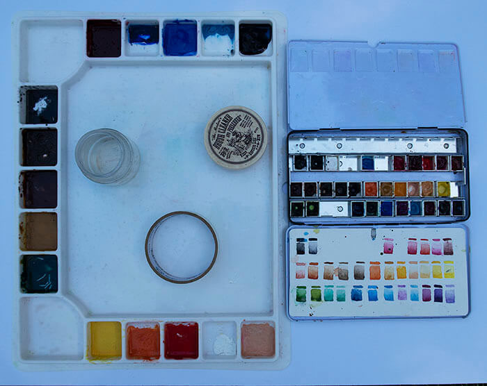 Some of the supplies you need to paint with watercolors.